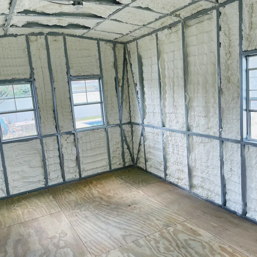 Closed-cell spray foam insulation applied to wall cavities in a residential project in Benton